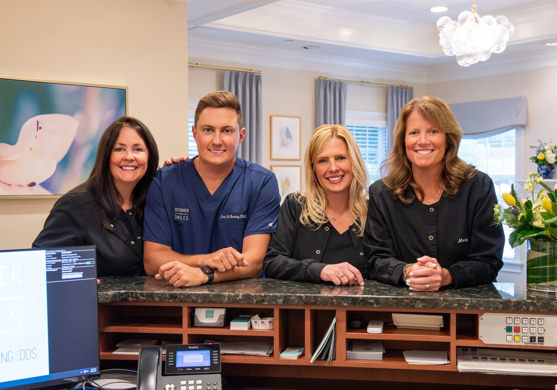 Dr. Eric Bunting with the front desk team