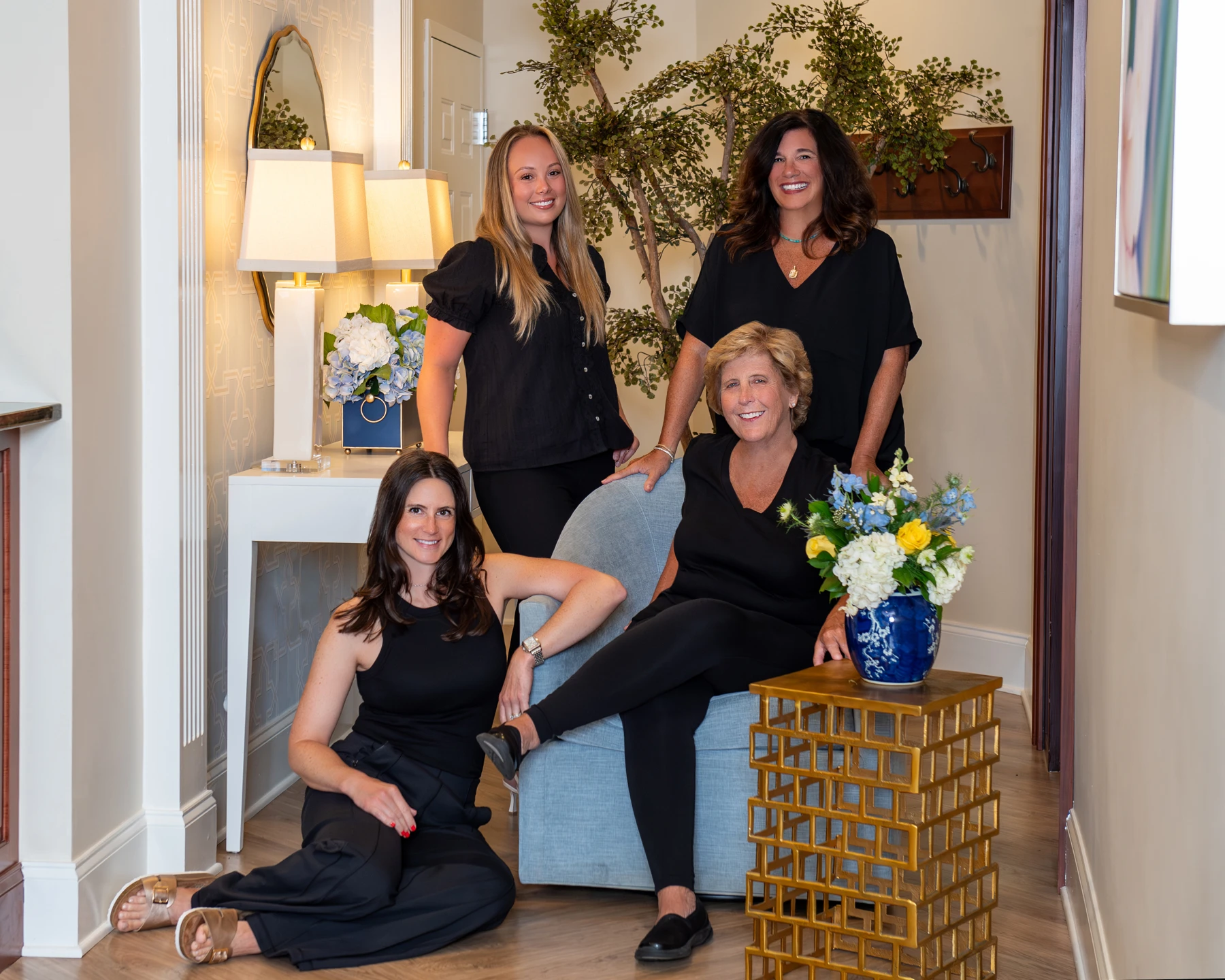 Designer of Smiles dental hygienists in formal attire