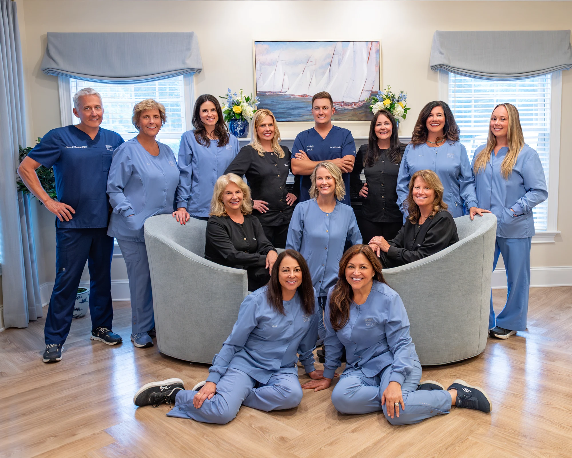 Drs. Steven and Eric Bunting with their team in scrubs